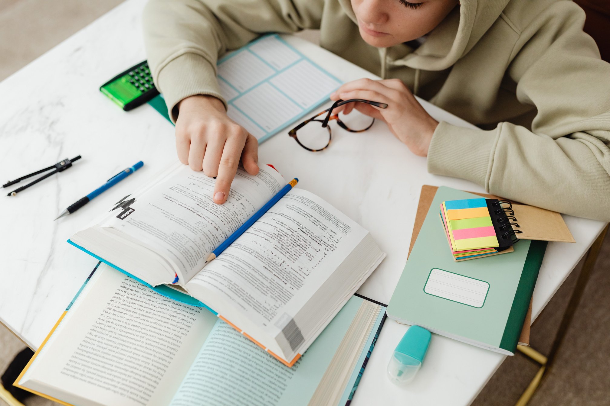 Young Man Reading A Book and Studying 